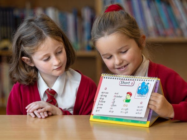 Two Girls Using Phonics Resources To Learn | KCS